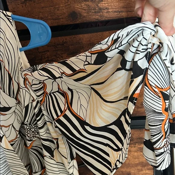 Adelyn Rae Black and Orange Patterned Romper - Picture 6 of 9